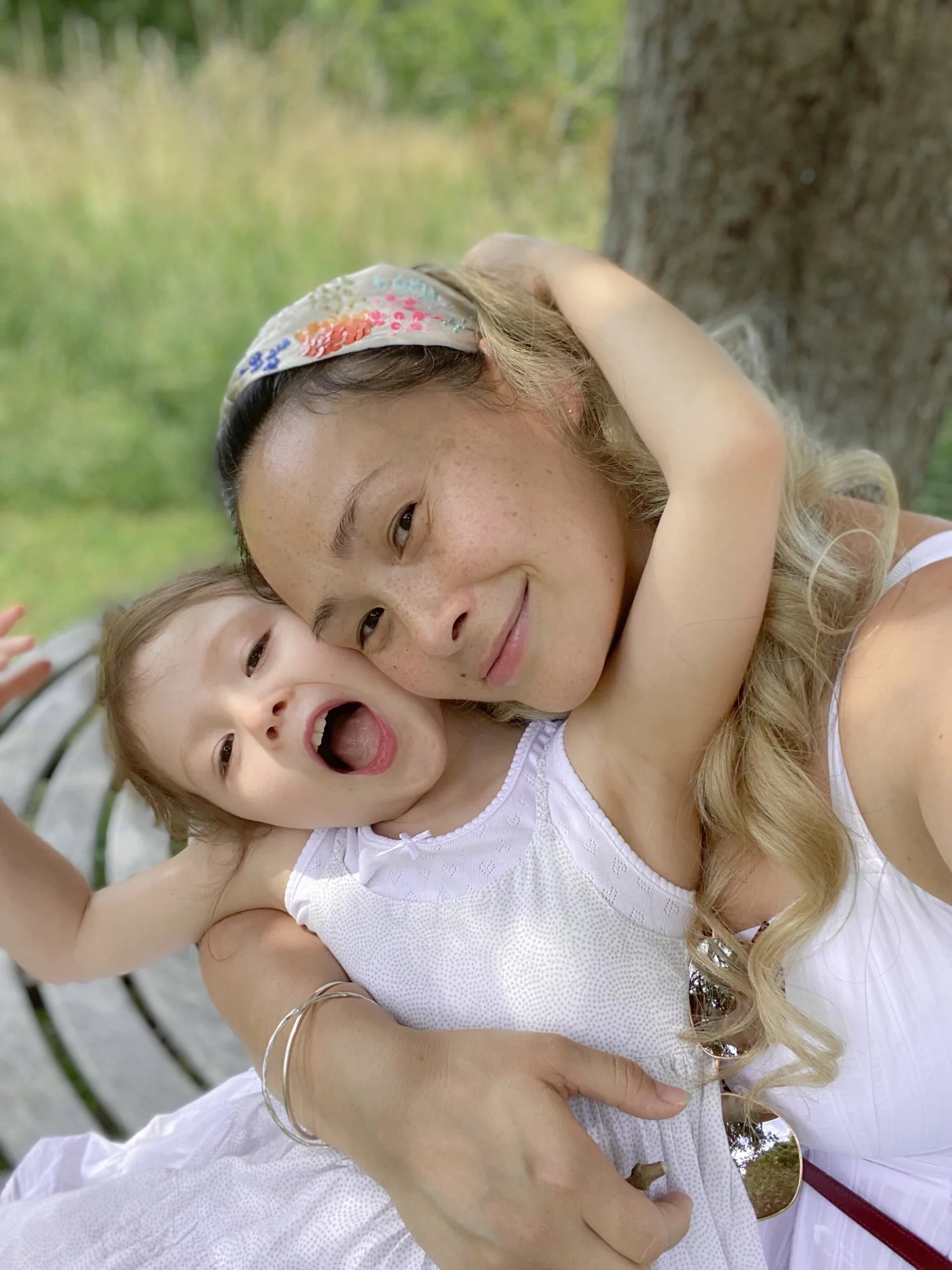 Kiki hugging her laughing daughter